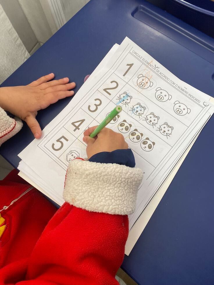 Child counting and circling numbers worksheet